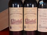 three bottles of wine sitting next to each other on a table