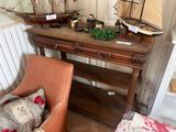 a wooden table with a boat on top of it