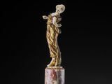 an image of a statue of a woman on a pedestal