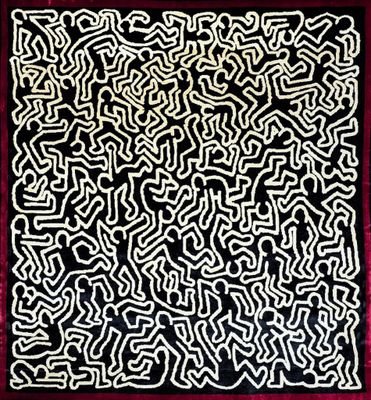 un gros plan sur un tapis noir et blanc bordé de rouge