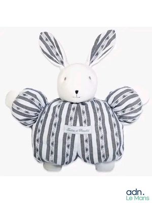 a stuffed animal that is sitting on a white surface