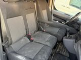 four seats in the back of a van with a steering wheel