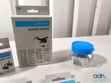 a box of bandages sitting on a table next to a package of bandages