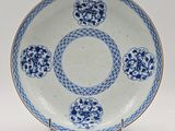 an image of a blue and white plate on a stand