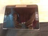 a reflection of a person holding a cell phone in a mirror