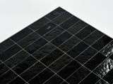 a black tiled floor with a white sky in the background
