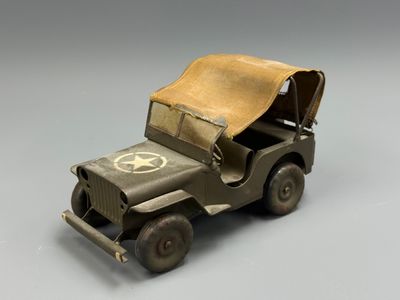 a toy army jeep with a star on the back