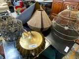 many different types of bird cages sitting on a table
