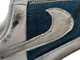 a close up of a pair of sneakers with a moon on them