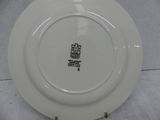 a white plate with a black and white design on it