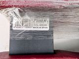 a piece of plastic wrapped in plastic on top of a red suitcase