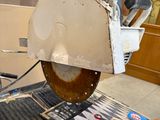 someone is using a circular saw to cut a piece of wood