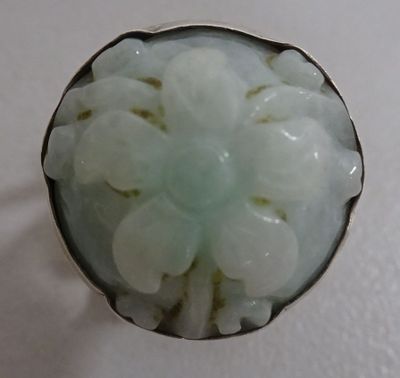 an image of a ring with a flower in the center