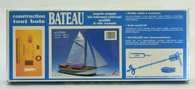 a box of construction tools and a boat on the table