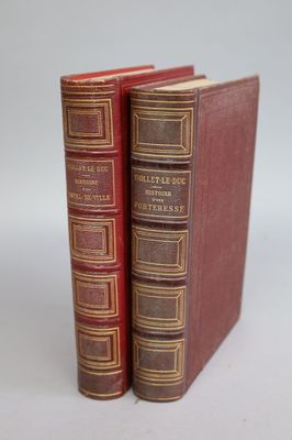 two books sitting on top of each other on a table