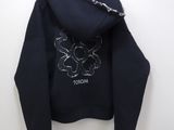 black hoodie with silver sequins on the back of the hoodie