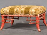 an image of a red bench with a gold and red upholstered seat