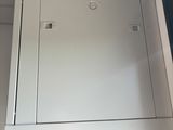 a metal cabinet with a door on the side of it
