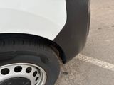 a close up of a tire on a white truck