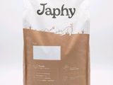 un sac de croquettes pour chiots posé sur une table blanche