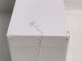 a close up of a white box on the floor