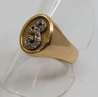 an image of a gold signet ring with a cross on it