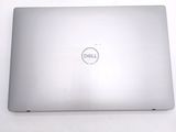 dell laptop with dell logo on the back of it