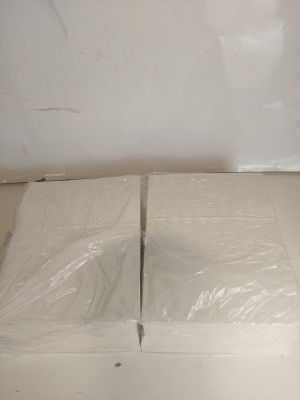 a white box that has two pieces of plastic on it