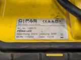 the back end of a yellow and black vehicle with a sticker on it