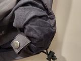 a shirt hanging on a hook on the wall