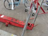 a bike that is sitting on a lift in the parking lot
