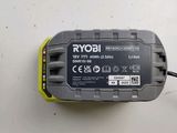 a yellow and black battery charger on a white surface