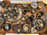 a box full of old metal dishes and pans