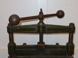 a green and black machine that is sitting on a table