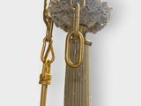 a statue of a person holding a key and a chain