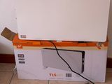 a box with a laptop on top of it sitting on the floor