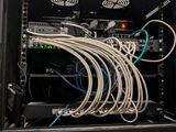 a rack with many wires in it in a room