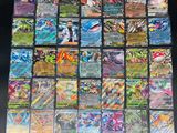 a large collection of pokemon cards are displayed on a table