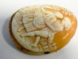 an image of a carved cookie with a man and woman on it