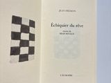 an open book with a black and white checkered pattern on it
