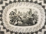 a black and white plate with a picture of a castle on it