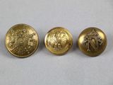 three gold buttons with a picture of a man and woman on them