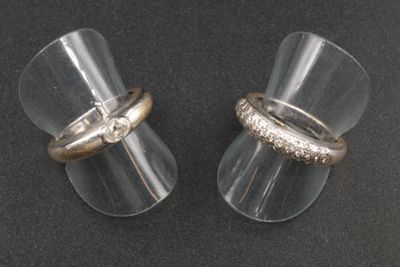 pair of clear acrylic ear plugs with gold and silver rings
