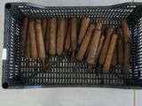 a lot of bamboo sticks in a basket on the floor