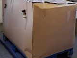 a large cardboard box on a pallet in a warehouse