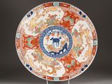 a plate with a design on it on a stand
