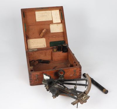 an old wooden box with tools in it on a white surface