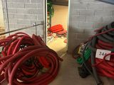 a lot of hoses that are sitting on the floor