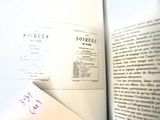 a book with a bookmark sticking out of it ' s cover