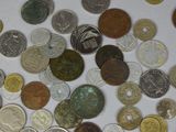 a lot of coins that are on the table